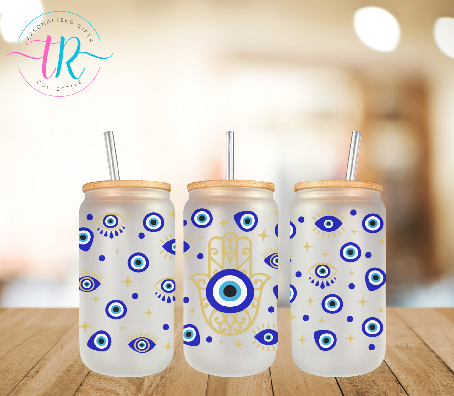 16oz-glass-tumbler-glass-can-glass-tumbler-with-straw-evil-eye-TR-collective-front_c1a34a0e-5938-4f00-bfc5-fa0d10be6631