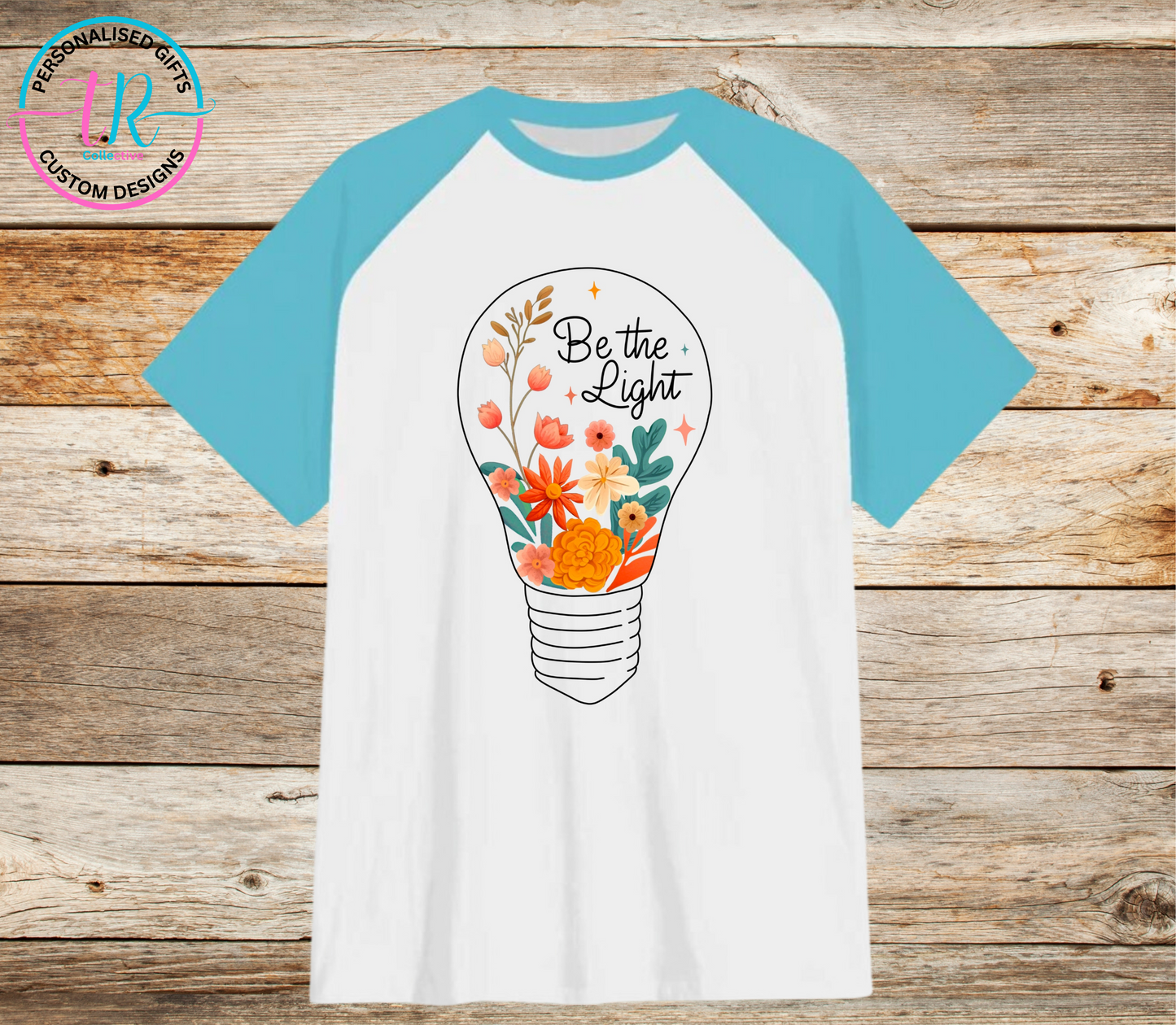 t-shirt-graphic-tees-shirts-be-the-light-light-blue-sleeve-TR-collective-front